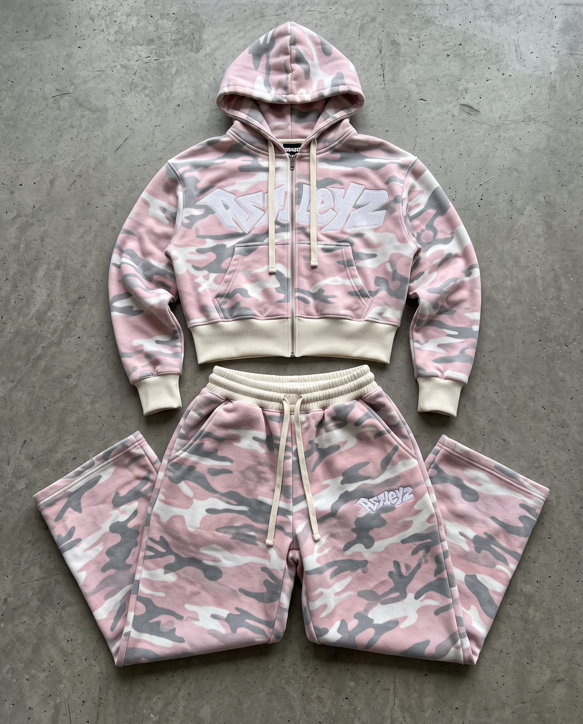 Astleyz Pink Camo Zip Set – on concrete