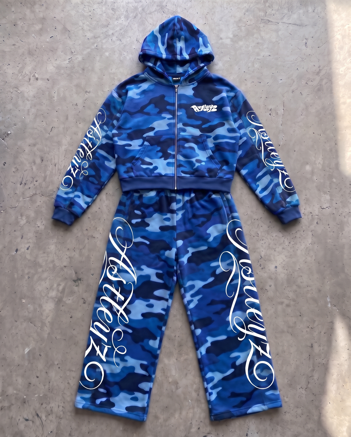 Astleyz Blue Script Camo Set – on concrete